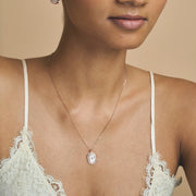 Rose gold blush pearl jewellery set with baguette crystal halo pendant necklace and matching stud earrings
