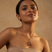 Rose gold geometric pendant necklace and matching drop earrings jewellery set with sparkling crystal accents for women.
