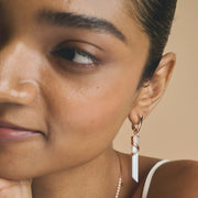 Rose gold prism jewelry set with white drop pendant necklace and matching crystal earrings

